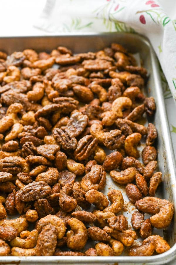 baked spiced mixed nuts on a sheet pan.