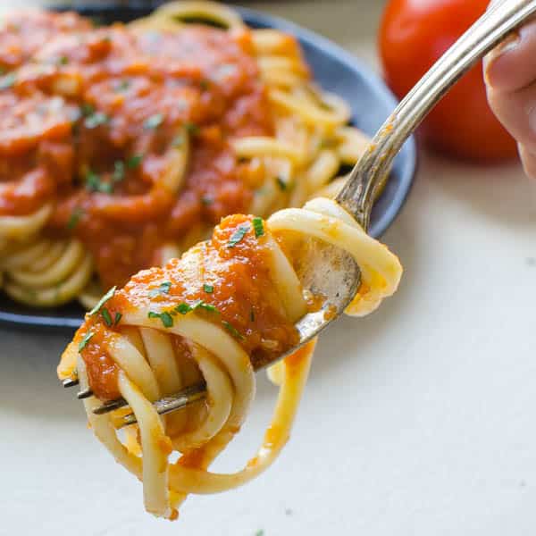 Marinara sauce on top of pasta.