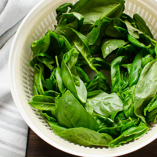 Dry the basil in a salad spinner.
