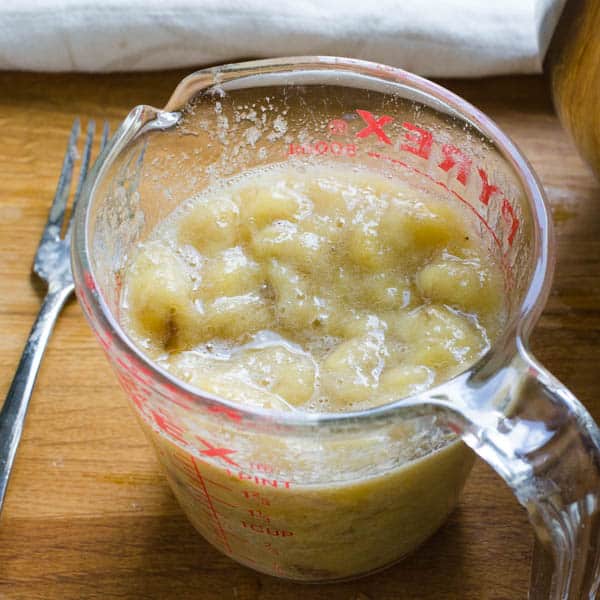 mashed bananas in a measuring cup.