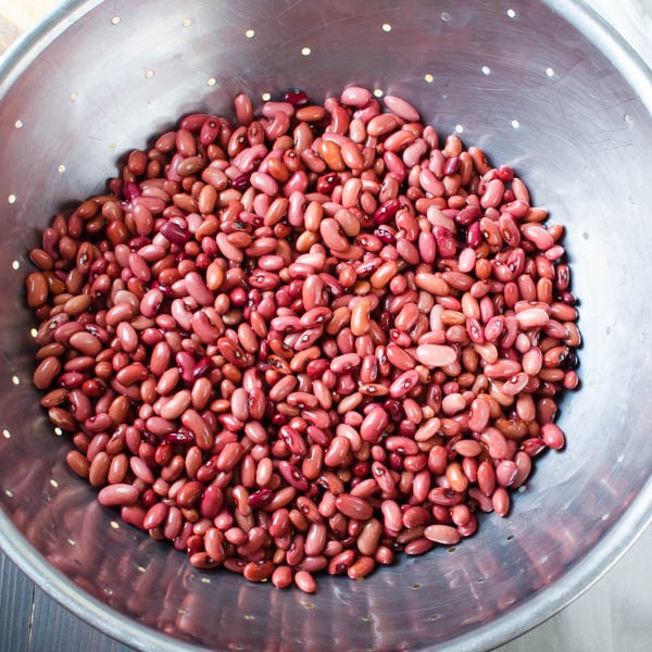 soaked red beans in a colander.