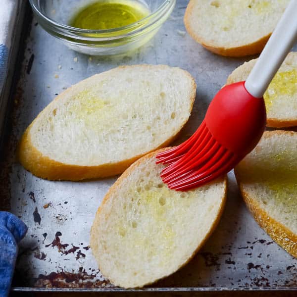 French bread, olive oil, pastry brush.