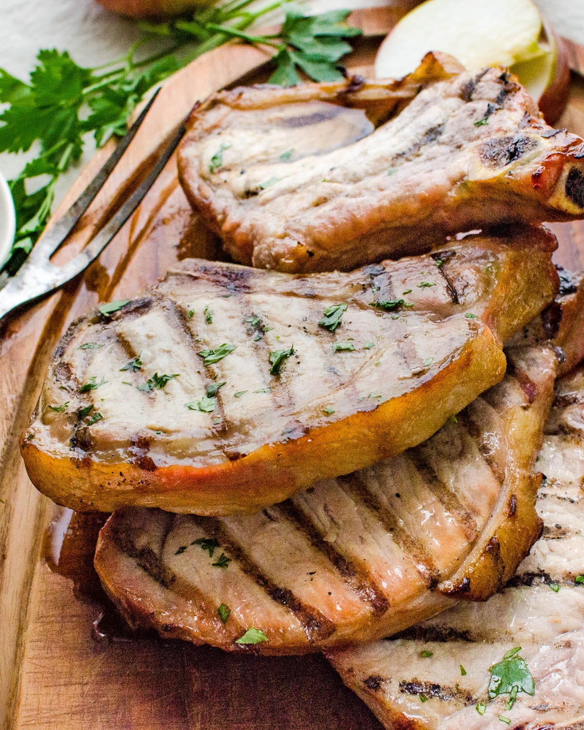 brined pork chops on a platter.