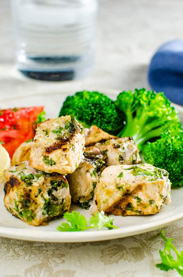 marinated swordfish kebab on a plate.