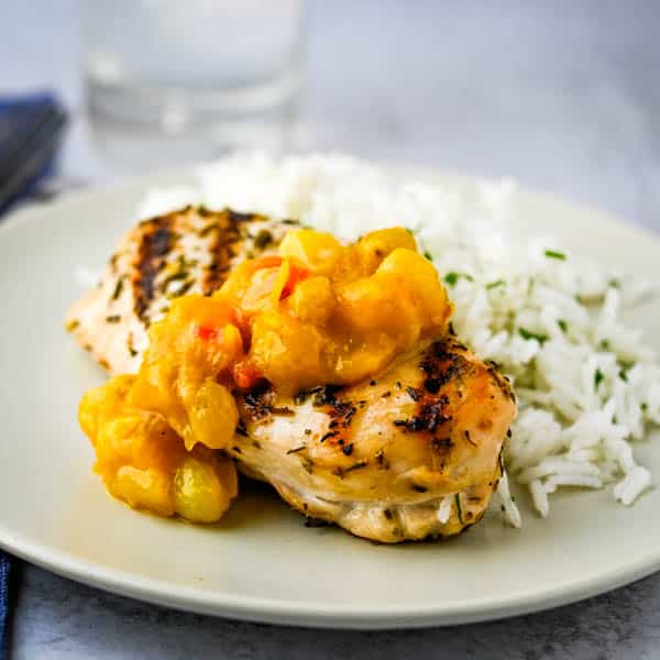 mango ginger chutney recipe on a piece of grilled chicken.