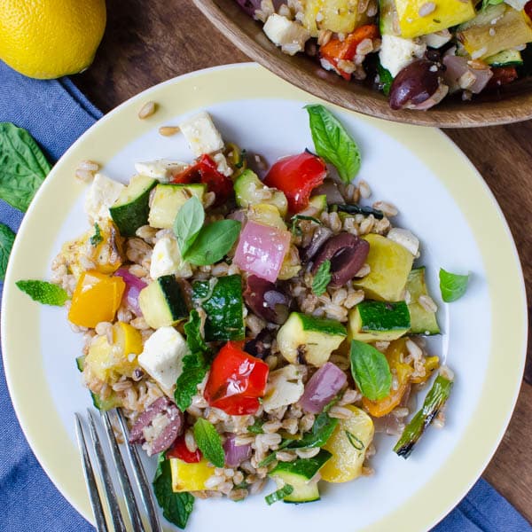 Grilled Vegetables with Feta and Farro with a fork and napkin.