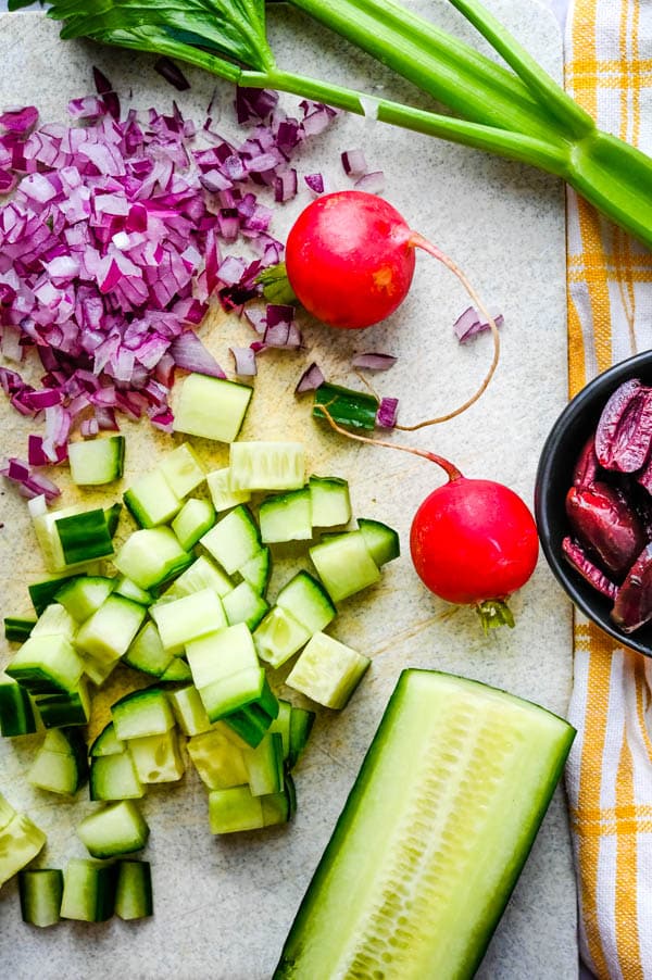chopped red onion, cucumber, radishes, celery and kalamata olives for salad.