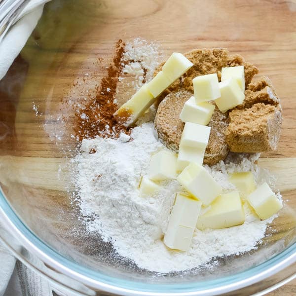 butter, flour, cinnamon, and brown sugar in a bowl.