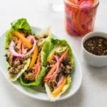 healthy turkey lettuce wraps with pickled veggies.