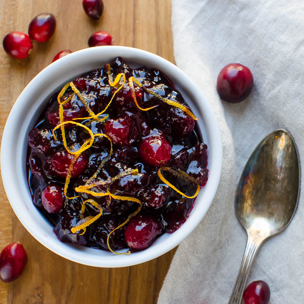 Holiday Cranberry Sauce in a dish with spoon