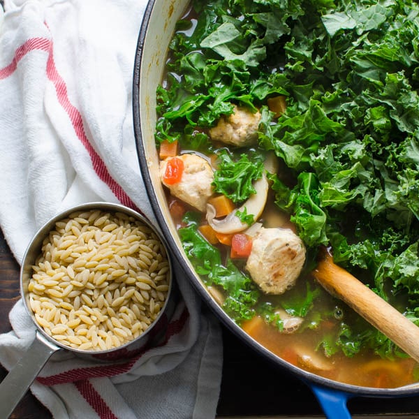 adding kale and orzo to soup