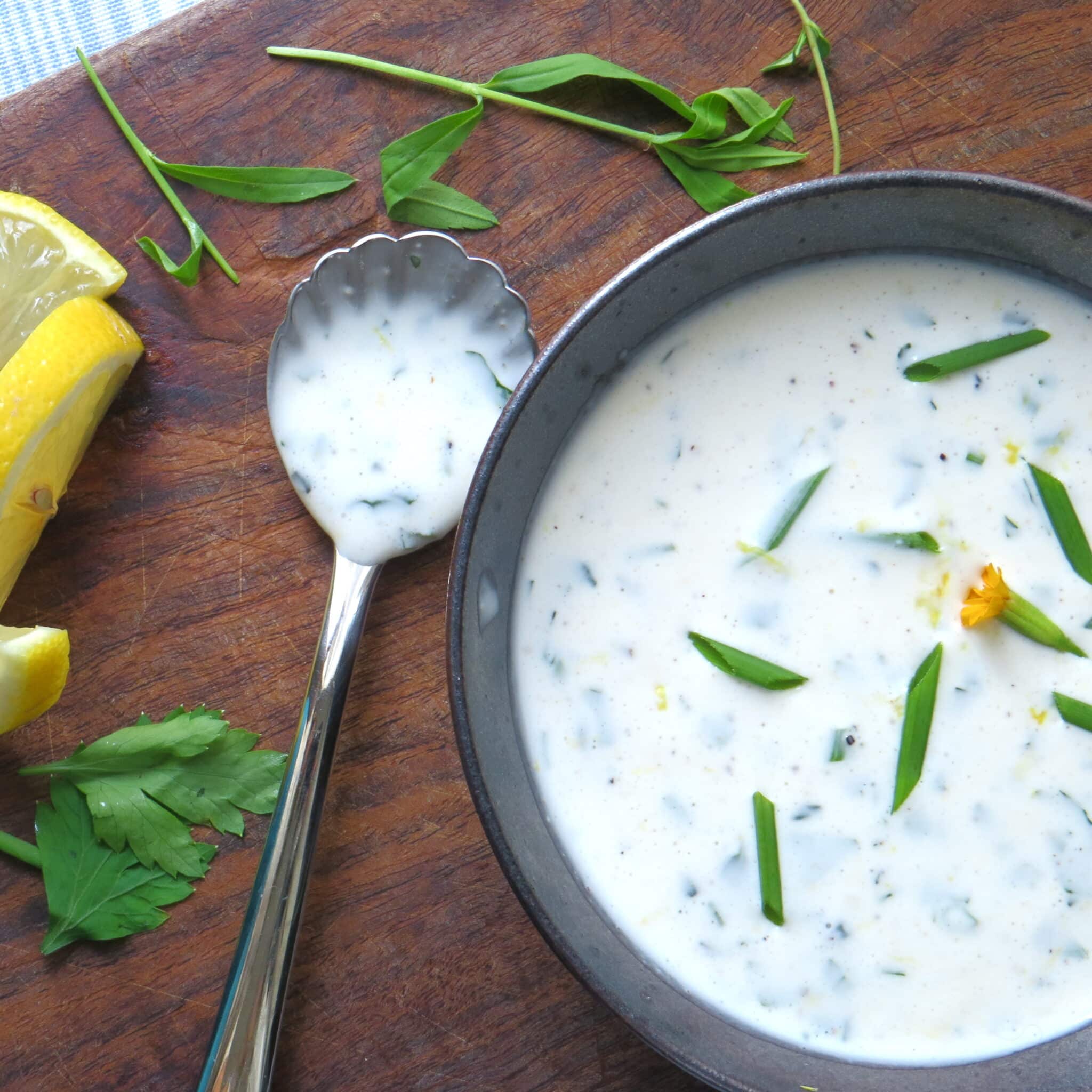 lemon herb buttermilk dressing with a spoon.