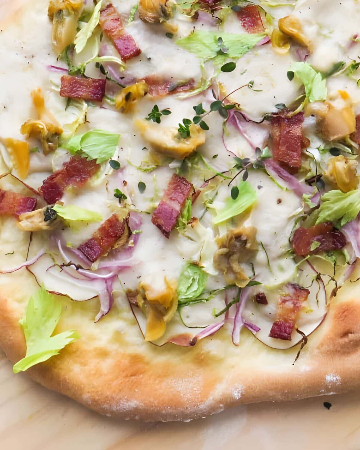 Clam chowda pizza with bacon, potatoes and celery.