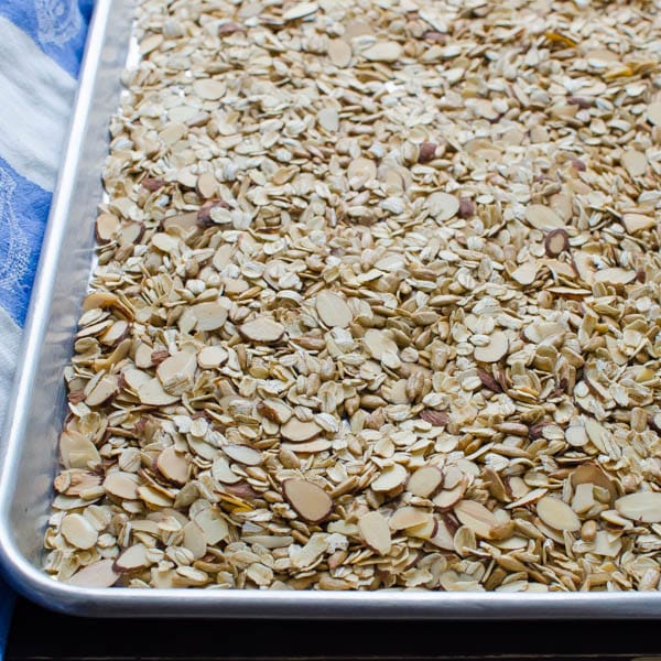 toasting almonds, oats, sunflower seeds and wheat germ