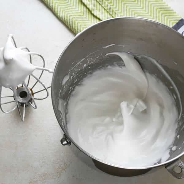 eggs beaten to glossy peaks for simple meringue recipe.