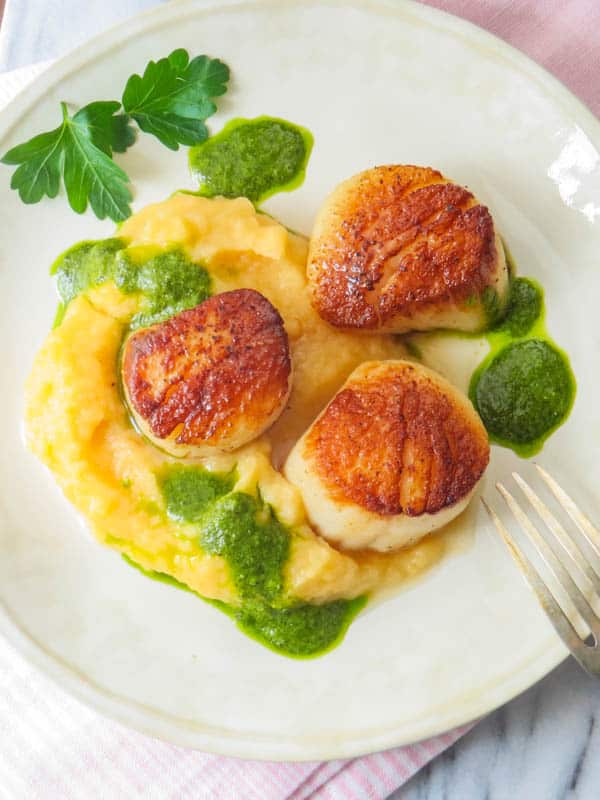 Beautifully seared diver scallops over root vegetable mash.