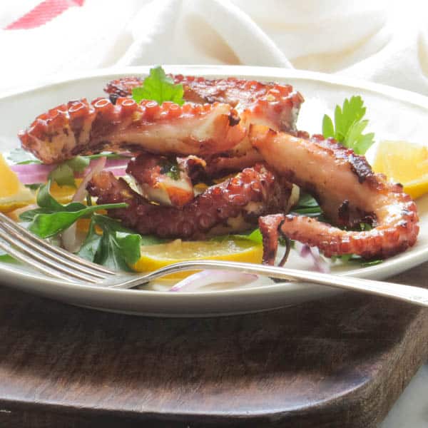 Grilled Octopus with a fork.