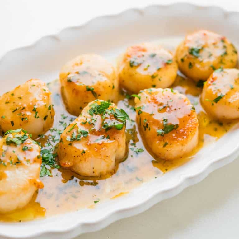 Scallops with white wine sauce.