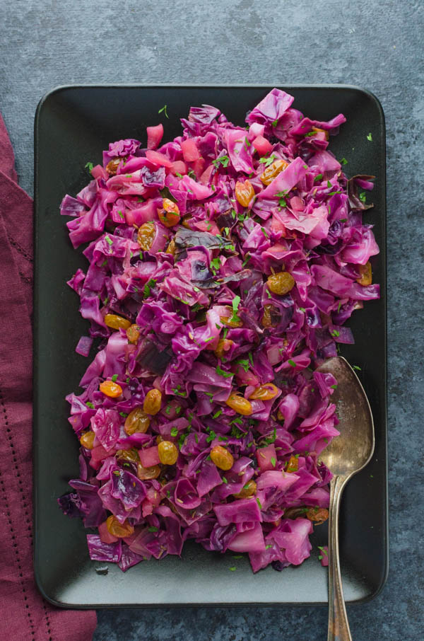 Sweet and Sour Red Cabbage with Apples and Raisins on a platter.