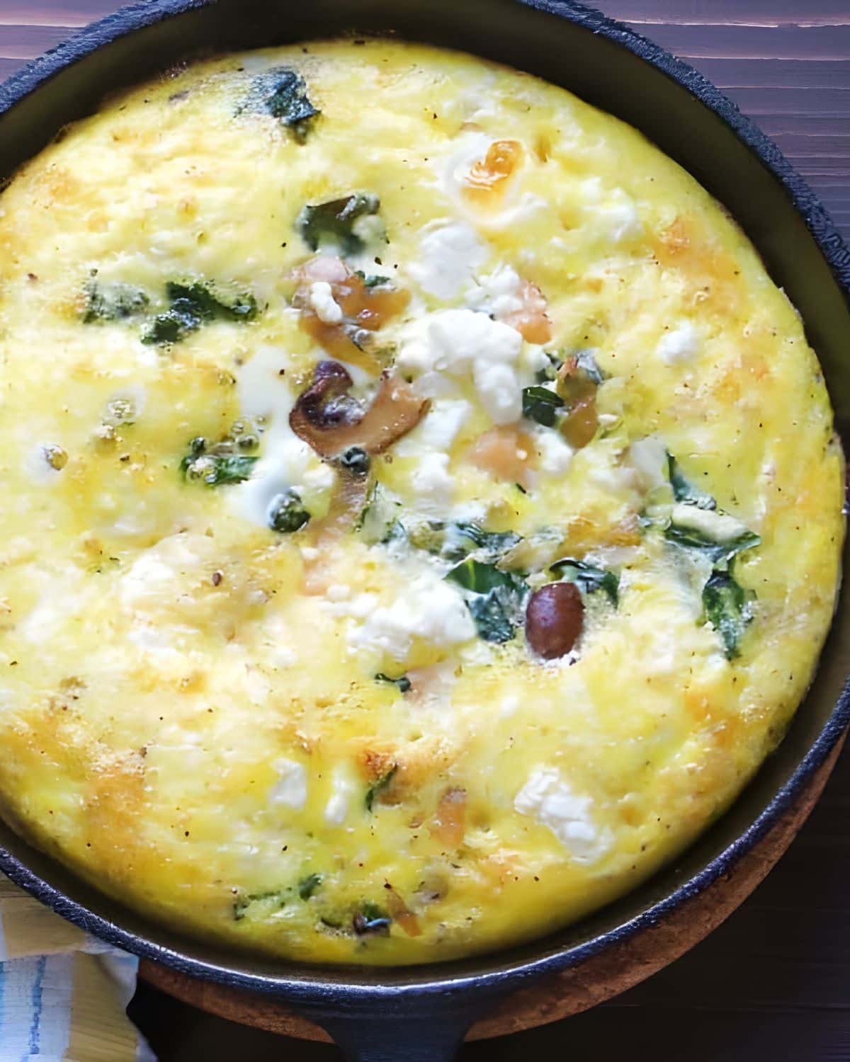 Salmon and caramelized onion frittata in a cast iron skillet.
