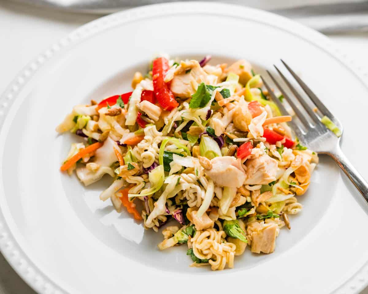 A serving of Asian chicken salad on a plate. 