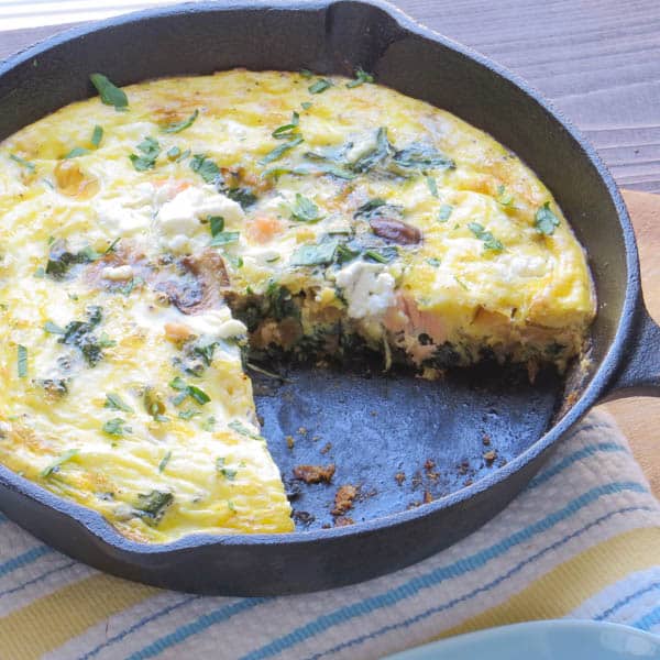 Salmon and Caramelized Onion Frittata missing a slice.