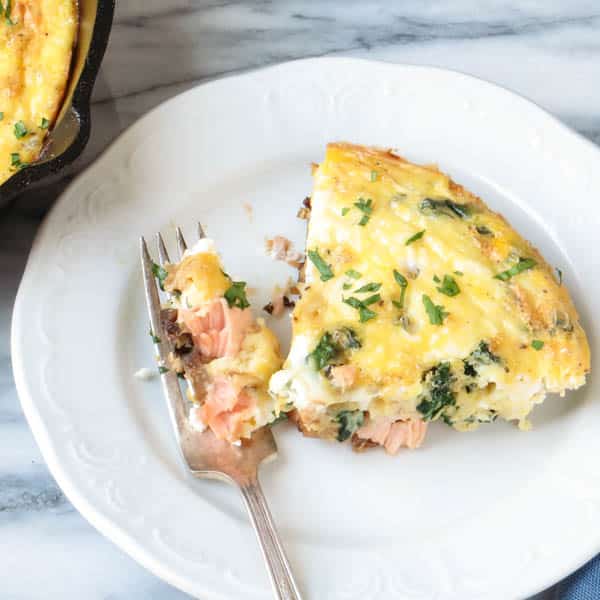 Salmon and Caramelized Onion Frittata on a plate with fork.