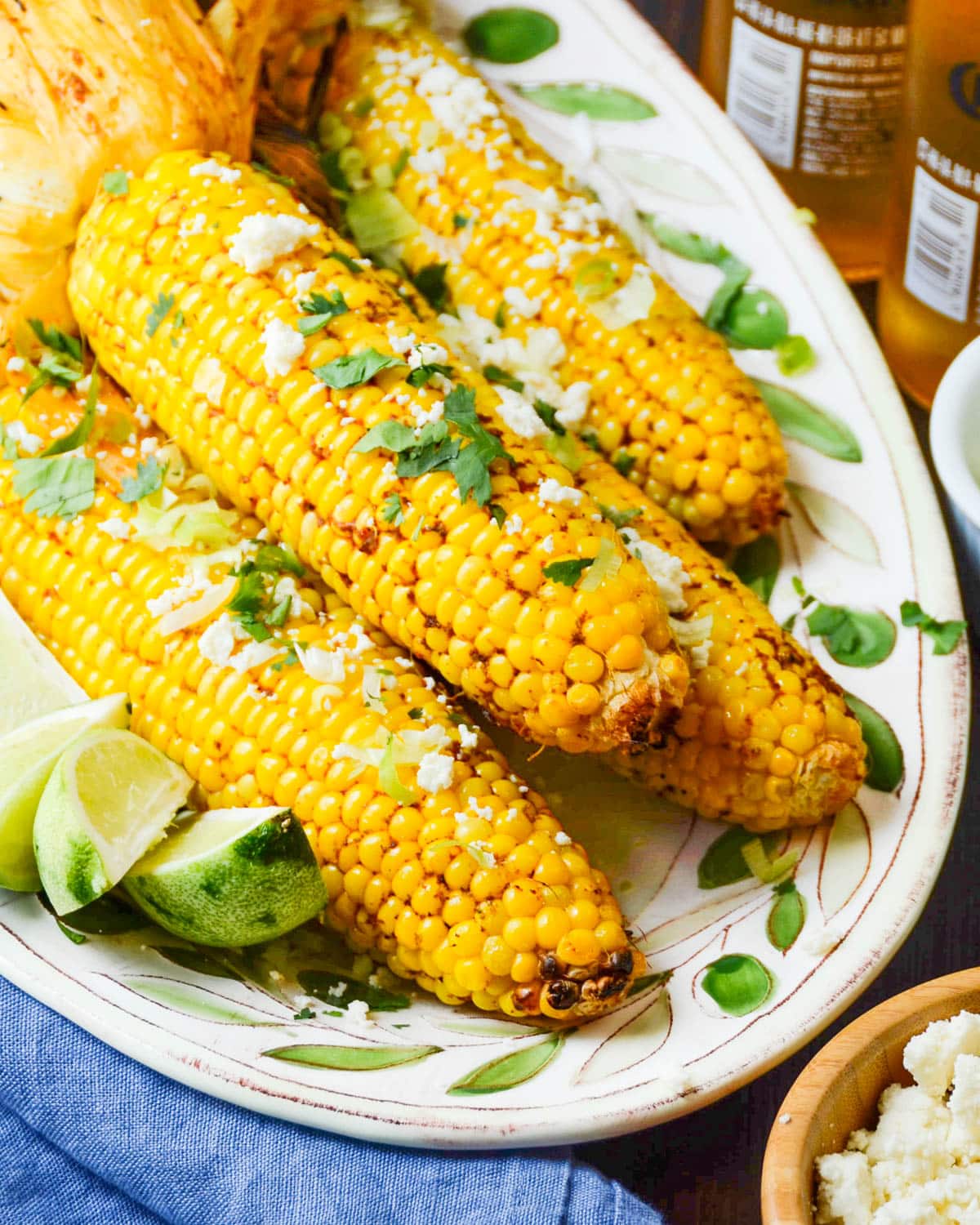 A platter of grilled corn on the cob with chipotle seasoning.