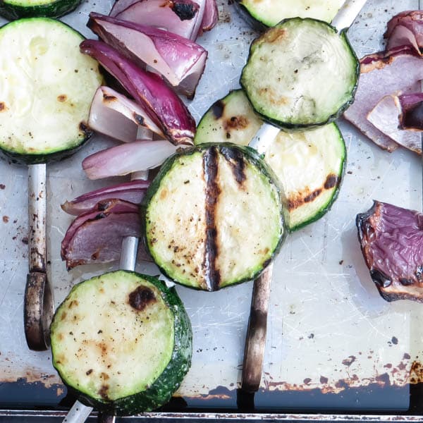 zucchini and red onions after grilling.