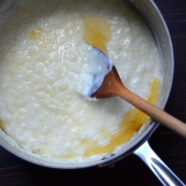 rice pudding with rum and wooden spoon