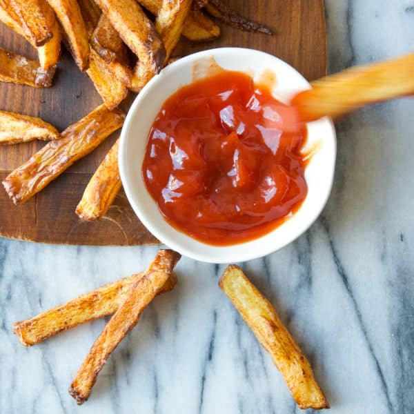 dipping fries in ketchup.