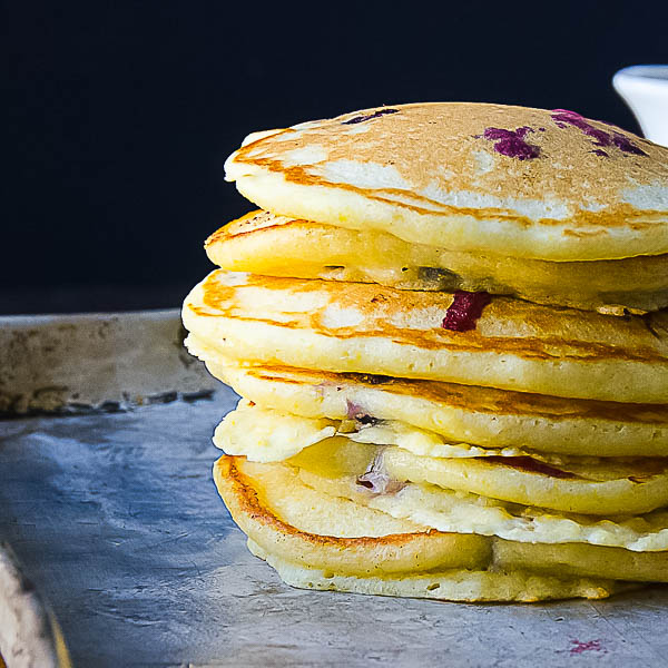 a stack of Blueberry Lemon Cornmeal Pancakes