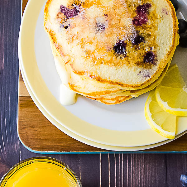 Blueberry Lemon Cornmeal Pancakes on a plate.