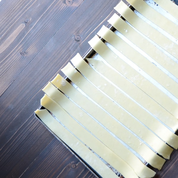 placing lattice strips on a baking sheet.