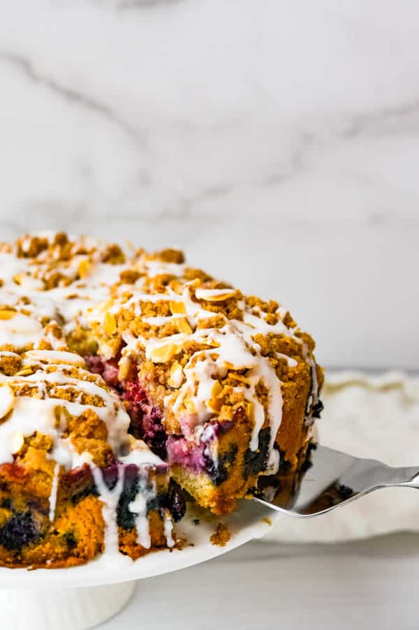 Cutting and serving berry buttermilk coffeecake.