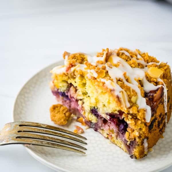 Berry Cake Recipe on a plate with a fork.