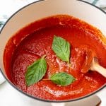 pomodoro sauce with fresh basil leaves.