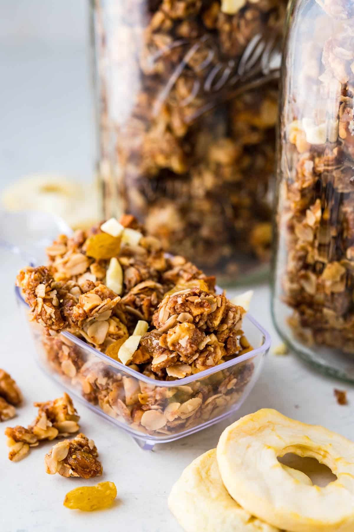 apple walnut granola clusters in a scoop.