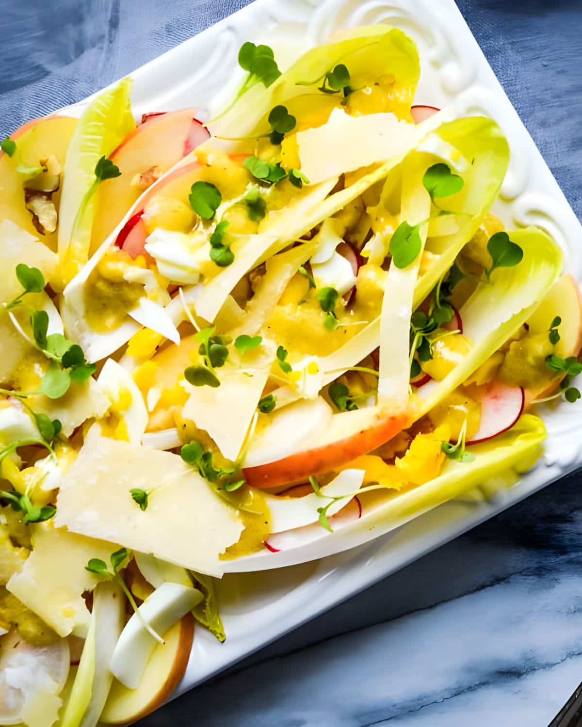 Endive salad with apples, and walnuts.