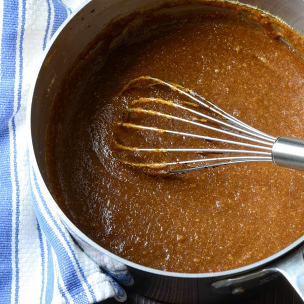 molasses mixture in pot with whisk
