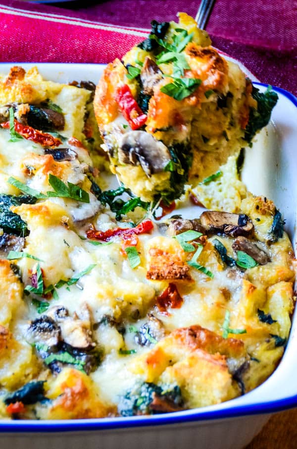spooning out the spinach and mushroom egg strata