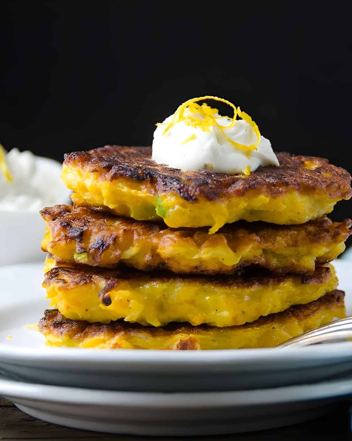 A stack of butternut fritters with goat cheese.