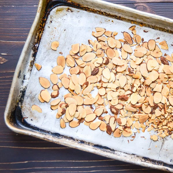toasted almonds on a baking sheet.