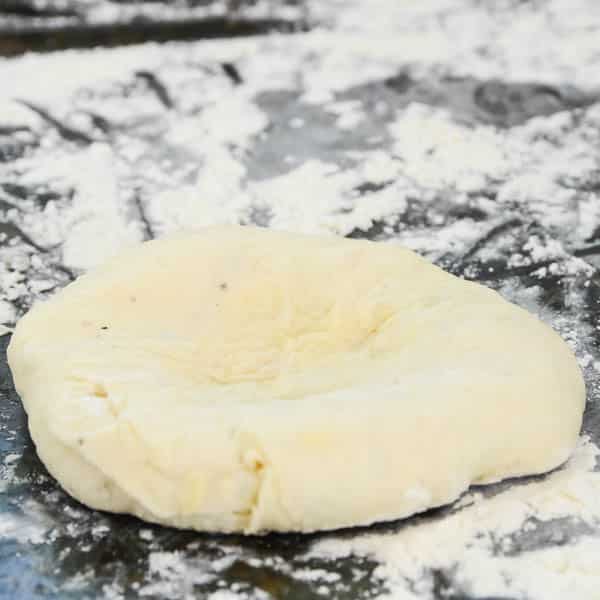 bialy dough on a floured surface