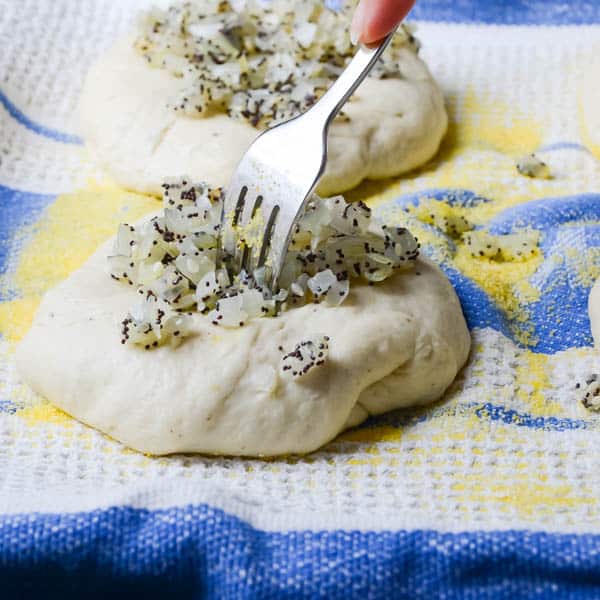 pricking bialy with a fork