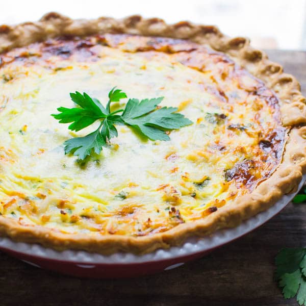 crab quiche with a sprig of parsley