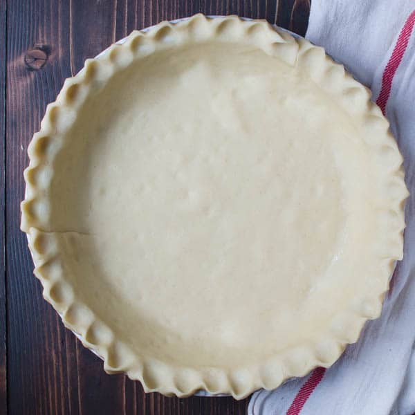 pie crust in a pie plan with fluted edges.