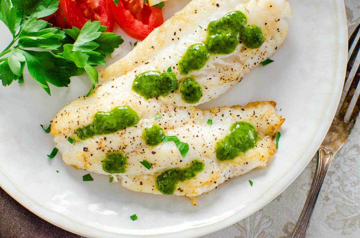 Dressing the fish with adriatic sauce.