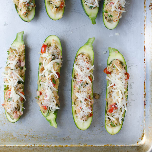 fill hollowed out zucchini boats with stuffing and cheese.