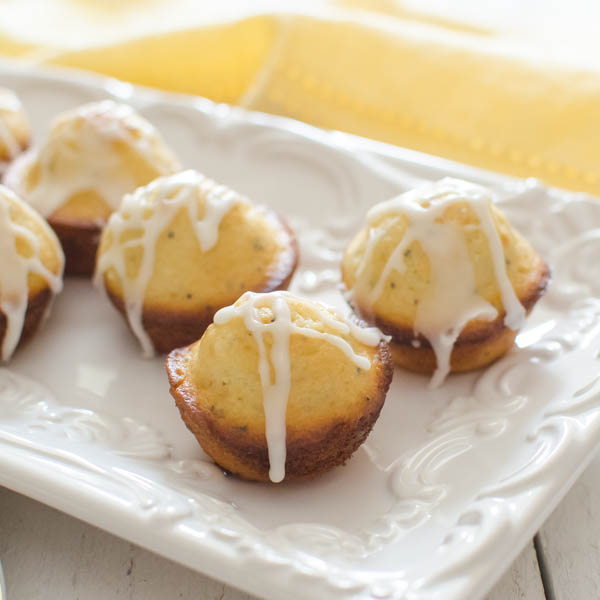 Glazed Lemon Poppyseed Mini Muffins on a tray